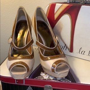 Dual color peep toe pumps. Worn a few times.